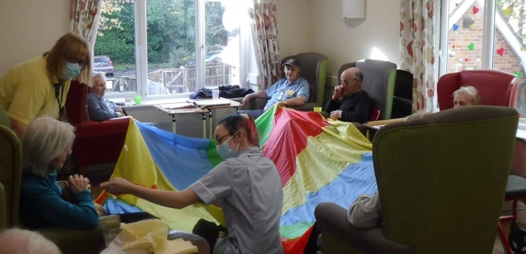 Residents taking part in a gentle fitness activity at ManuCourt care home