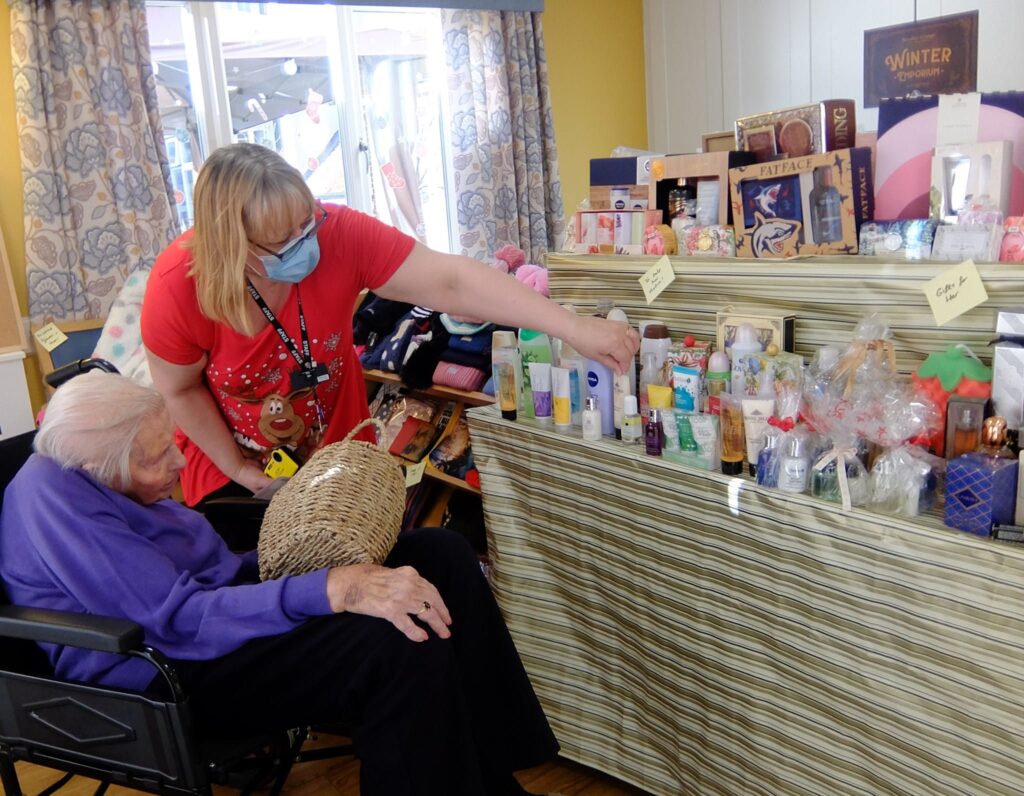 Residents visiting a Christmas shop activity at ManuCourt care home