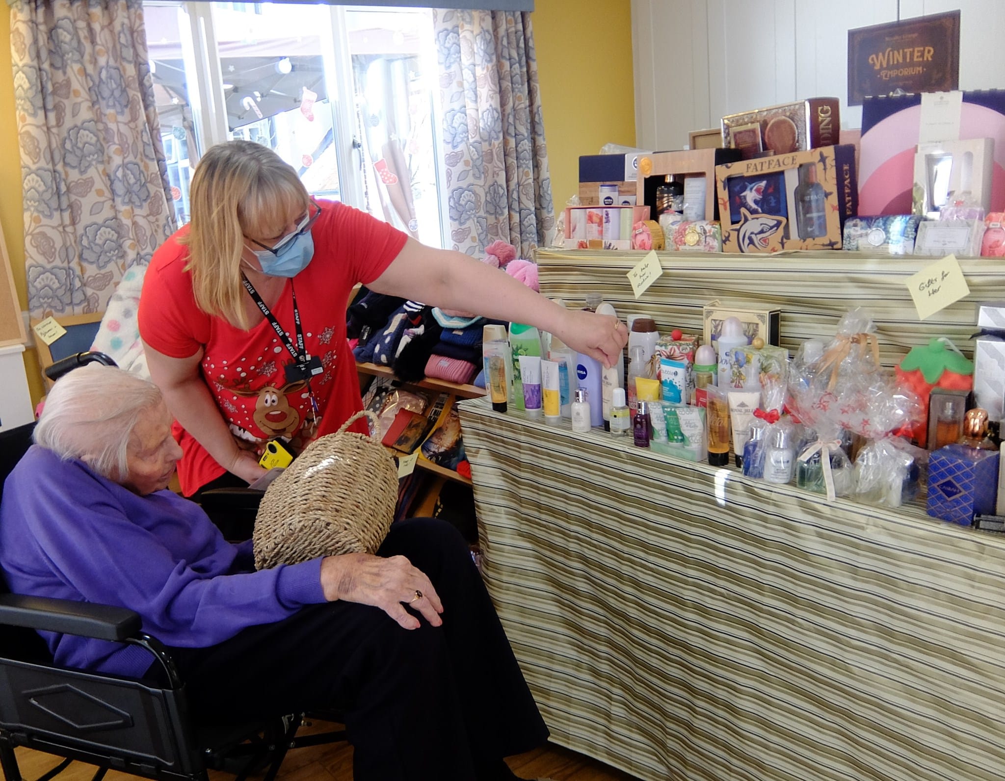 Residents visiting a Christmas shop activity at ManuCourt care home