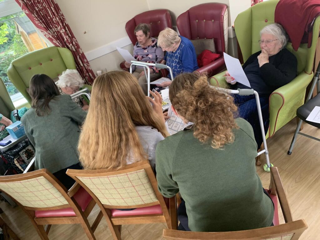 Residents enjoying a group activity at ManuCourt care home
